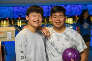 Two boys bowling